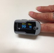 Finger pulse oximeter - oxygen saturation number on left and pulse on right